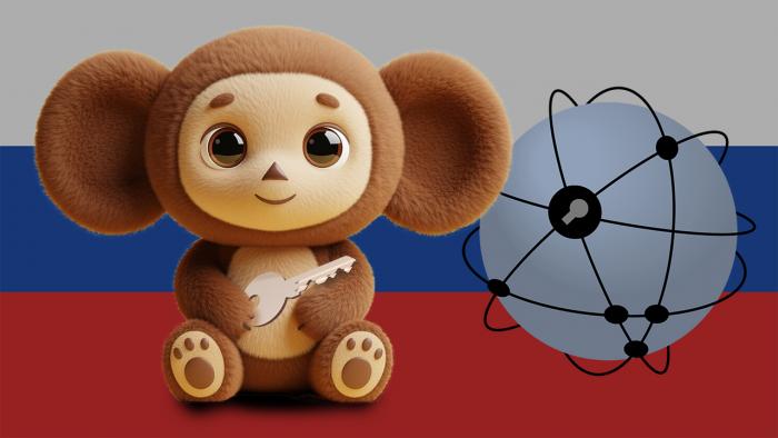 Чебурашка с ключом перед российским флагом и символом WWW